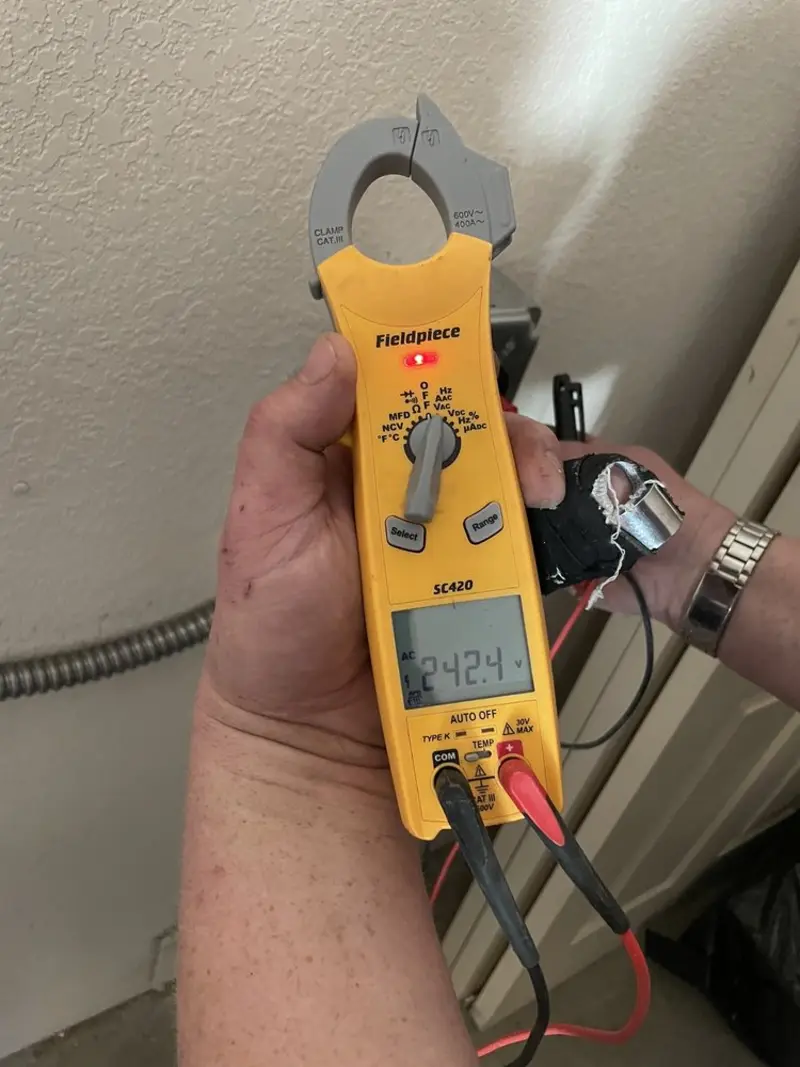 Voltage testing with clamp meter during Hot Tub / Pool Electrical Wiring in North Kansas City